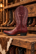 A red-burgundy leather cowboy boot with decorative stitching.