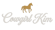 A logo featuring a gold horse silhouette above the cursive text 'Cowgirl Kim' in a light beige/cream color, set against a plain white background.