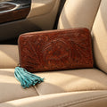 Ariat tooled leather wallet, floral design with turquoise zipper pull.