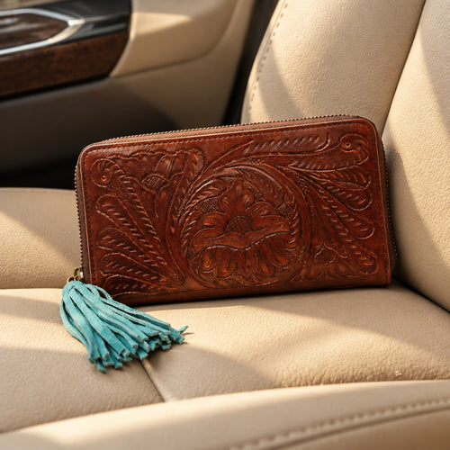 Ariat tooled leather wallet, floral design with turquoise zipper pull.